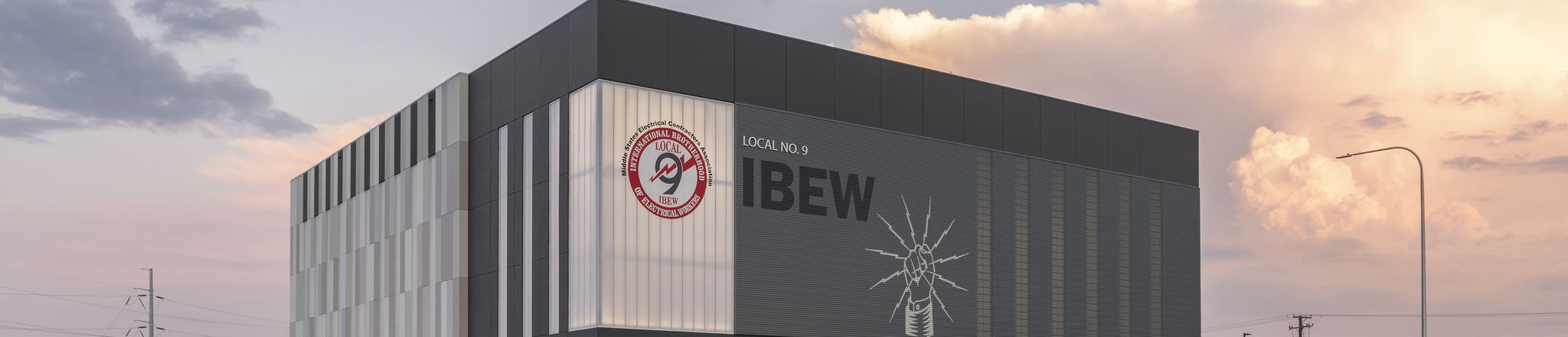 evening shot of IBEW training building with sky