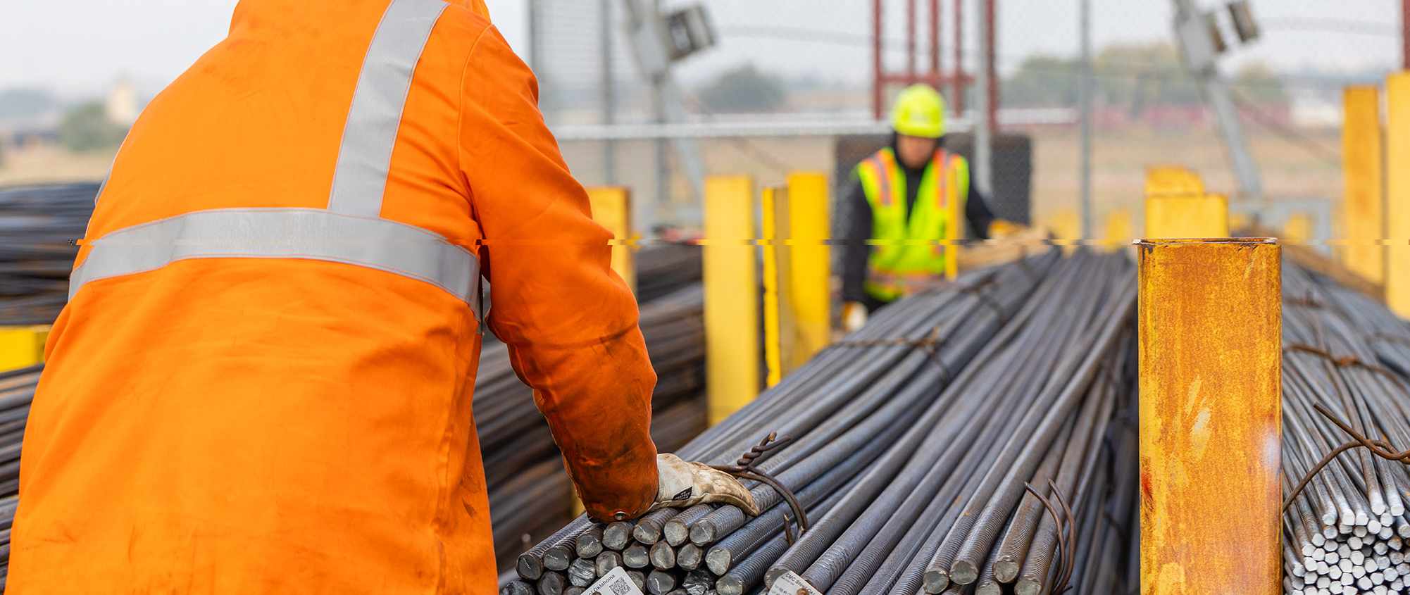 workers on job site with rebar