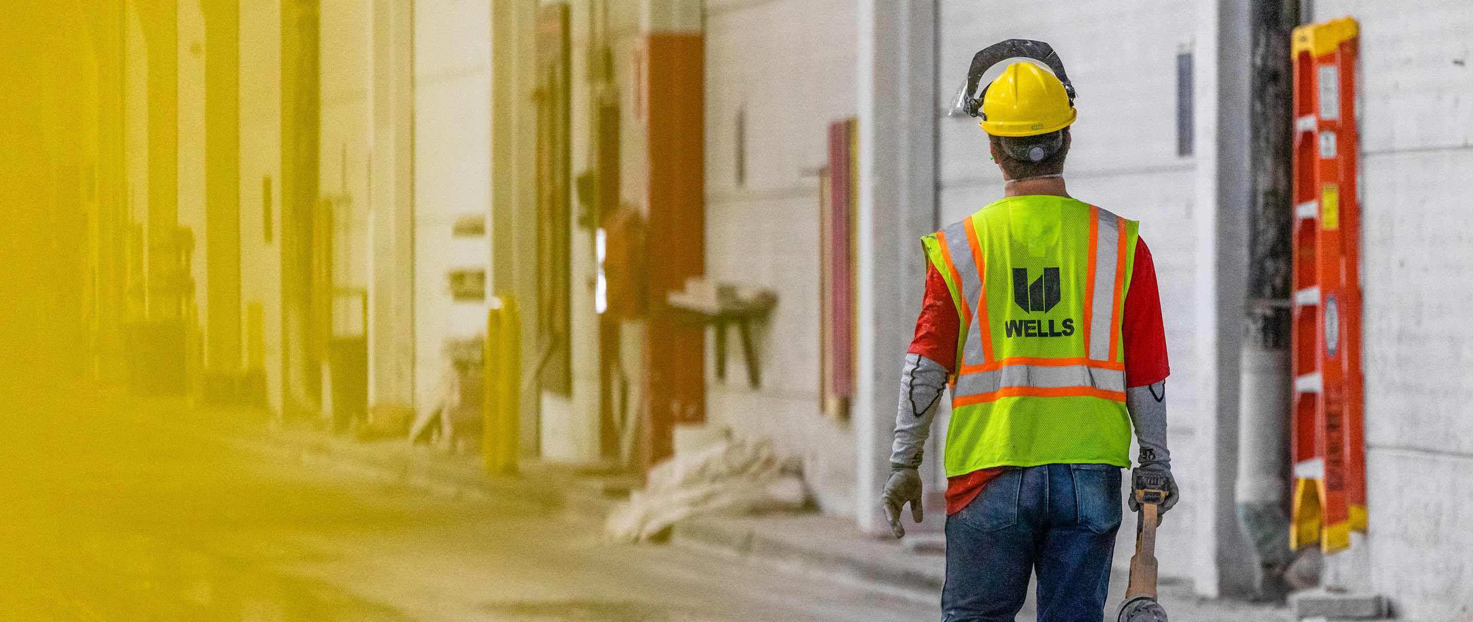 employee walking in manufacturing facility