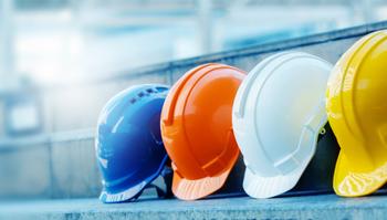 multi-color safety hardhats in a row