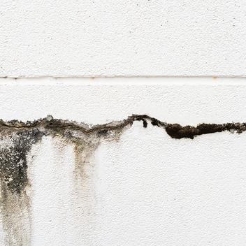 a large crack formed in a concrete wall