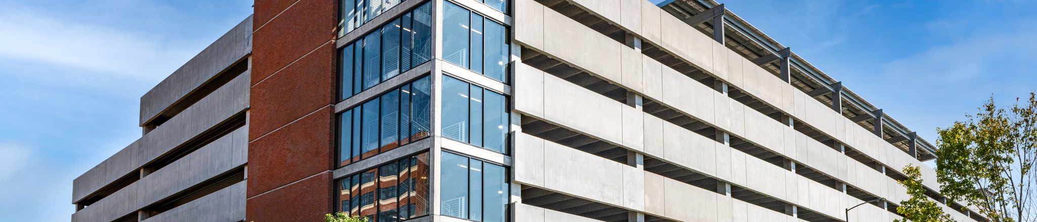 wide corner view of parking structure with sky