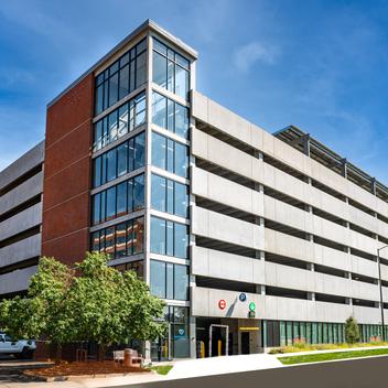 wide corner view of parking structure with sky
