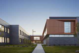Exterior view of Sartell High School at night