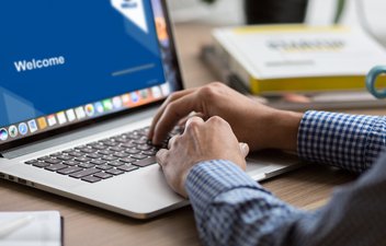 user watching wells webinar on computer
