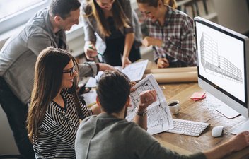 workers around a computer