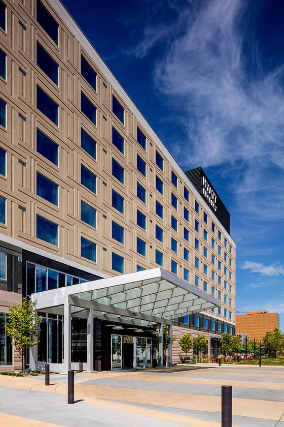 Angled picture of the front entrance of Hyatt Regency Hotel at Bloomington Central Station.