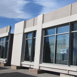 Sections of Infinite Facade standing vertically on a concrete platform.