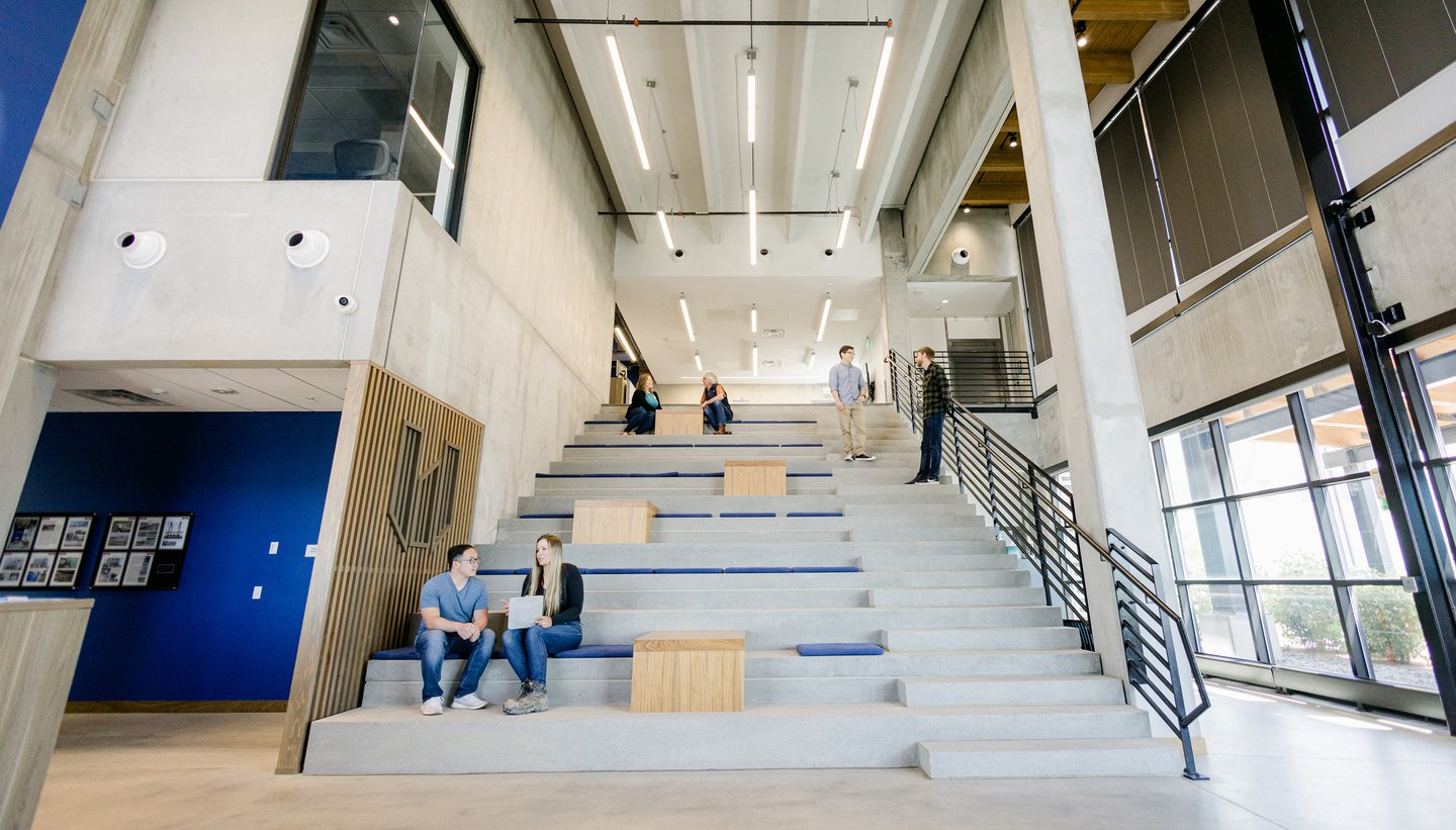 employees on the stairs of brighton facility