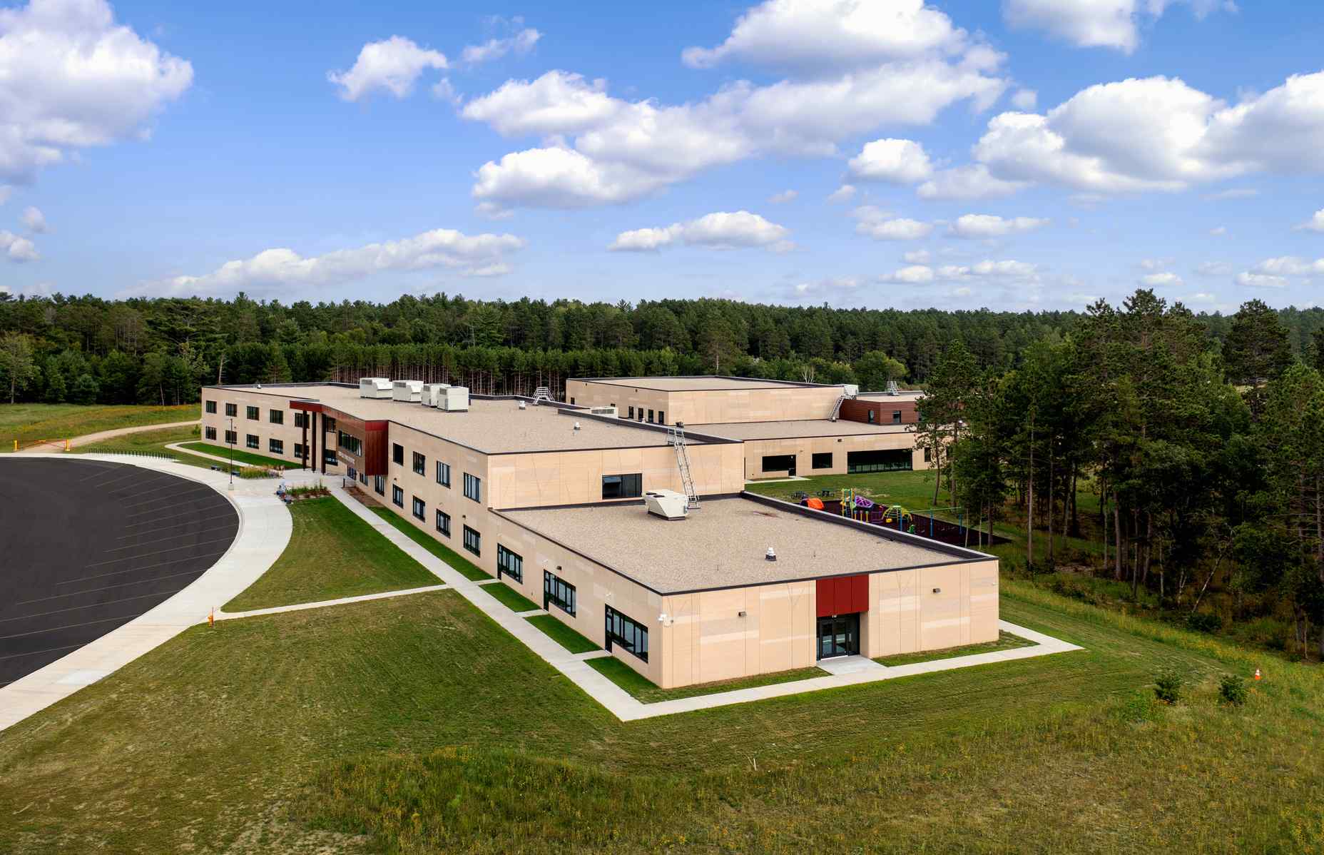 side aerial view of cass lake bena elementary school with panel reveals