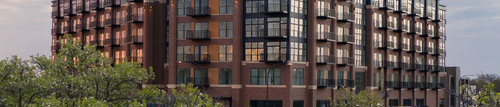 Wide full-view image of lofts with sky