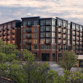 Wide full-view image of lofts with sky