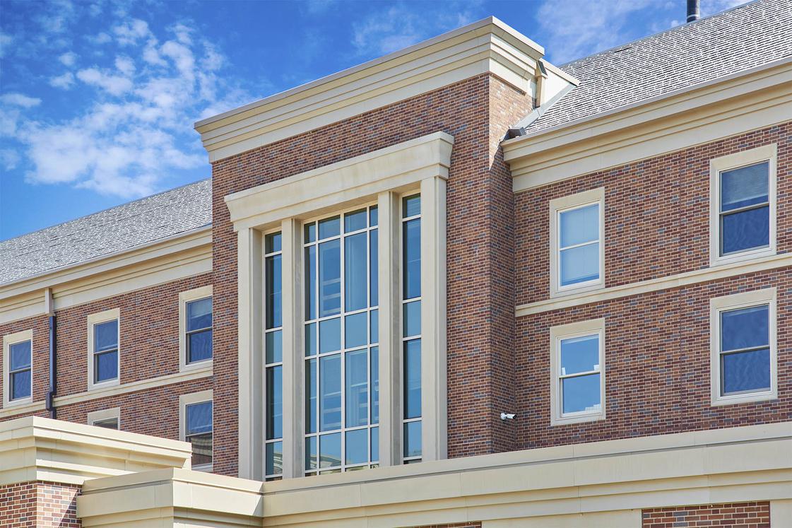 Close up view of the red brick and windows of Pioneer Hall