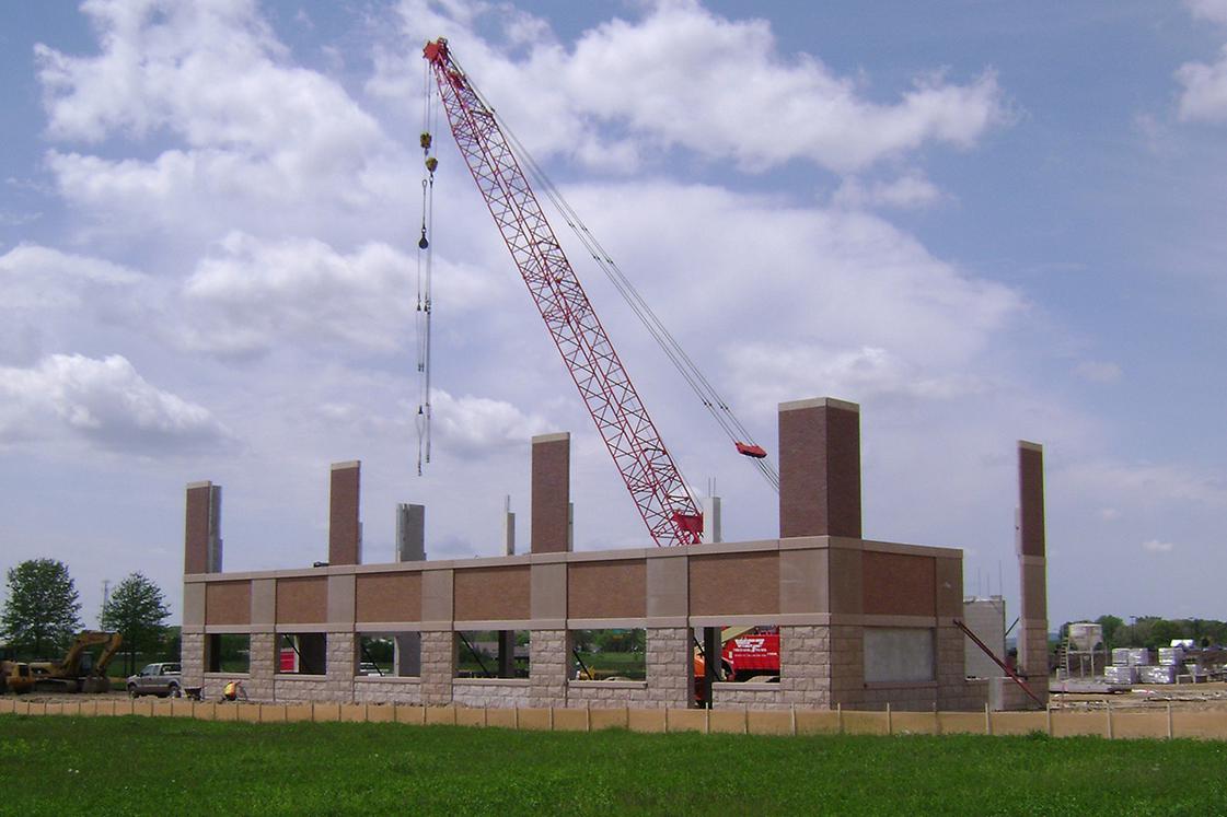 spandrels on building during construction with crane in background