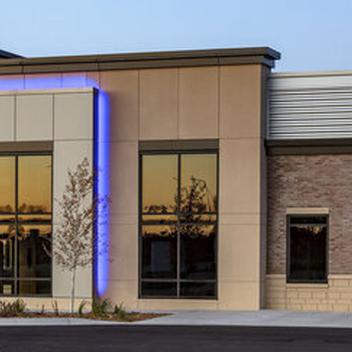 Wide shot of Twin Cities Orthopedics office at sunset