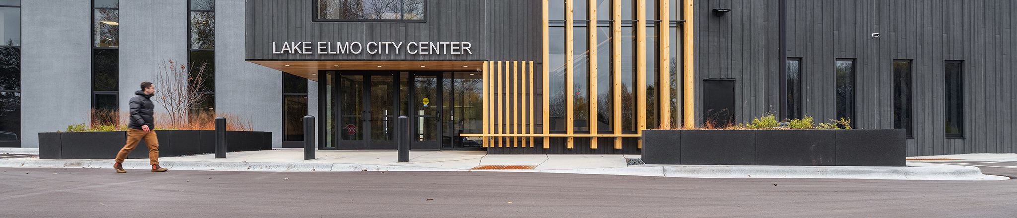 entrance of lake elmo city center with flag and sky