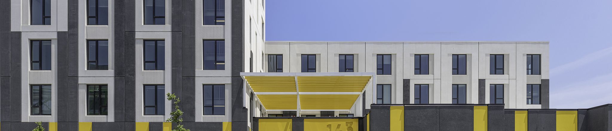 entrance view of westhaven park station precast housing development in chicago
