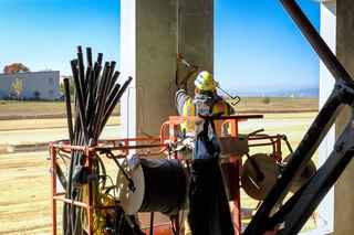 sealants worker applying caulk to precast joint