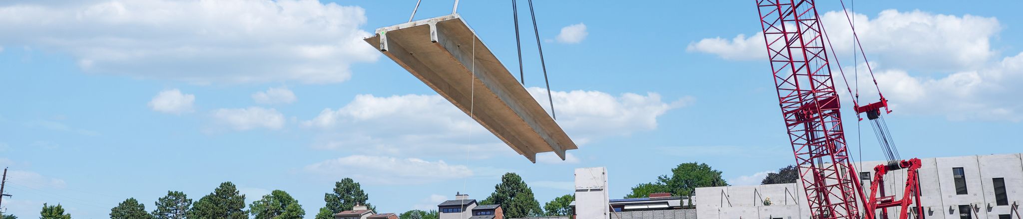 a double tee being lifted by a crane