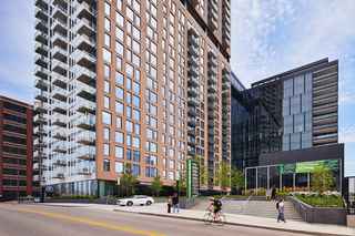 street view of North Loop Green in Minneapolis, MN, which uses precast concrete panels to enclose the high-rise building
