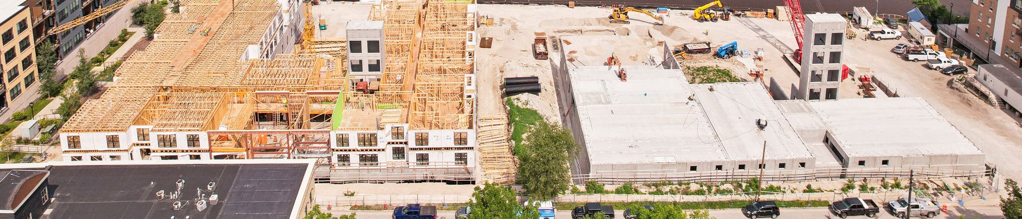 river house apartments 3 & 4 during construction with milwaukee river behind