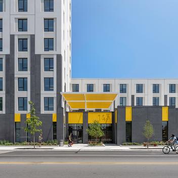 entrance view of westhaven park station precast housing development in chicago