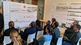 People sitting around a whiteboard