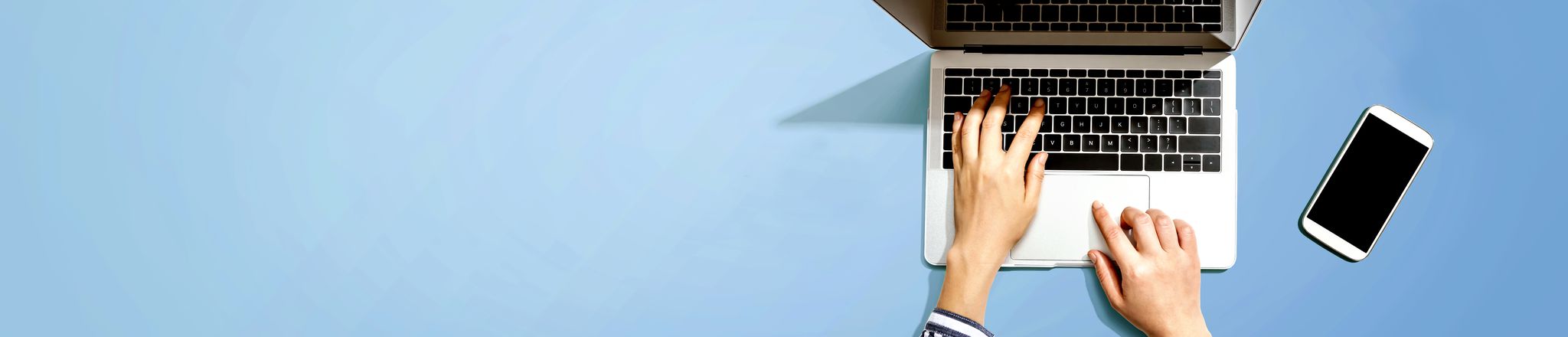 laptop user attending a wells webinar