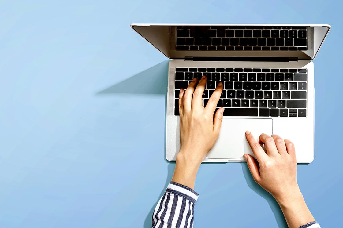 person typing on computer